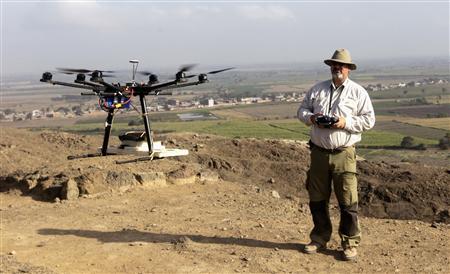 Luis Jaime Castillo, a Peruvian archaeologist with Lima's Catholic University and an incoming deputy culture minister, flies a drone over the archaeological site of Cerro Chepen in Trujillo August 3, 2013 - CREDIT: REUTERS/MARIANA BAZO