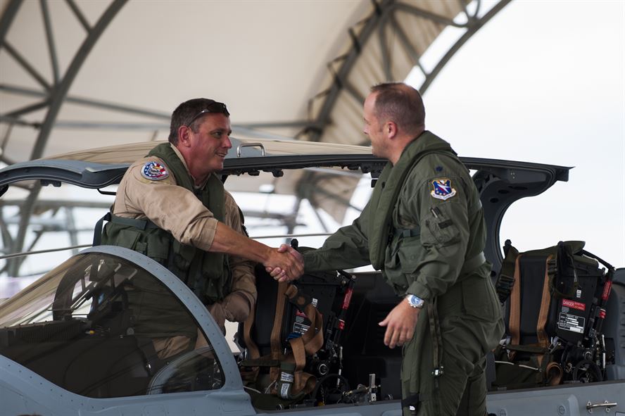 Chris Carlson, left, Sierra Nevada Corporation senior pilot, shakes hands with Lt. Col. Jeffrey Hogan, Afghan A-29 Light Air Support training unit commander, after landing an A-29 Super Tucano for its first arrival Sept. 26, 2014, at Moody Air Force Base, Ga. Moody was selected for the A-29 LAS training mission to train a total of 30 Afghan pilots and 90 Afghan maintainers over the next four years. (U.S. Air Force photo/Airman 1st Class Dillian Bamman) Source: http://www.af.mil/News/Photos/tabid/129/igphoto/2000945466/Default.aspx